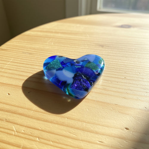 Blue and green fused glass pocket heart with shimmering accents